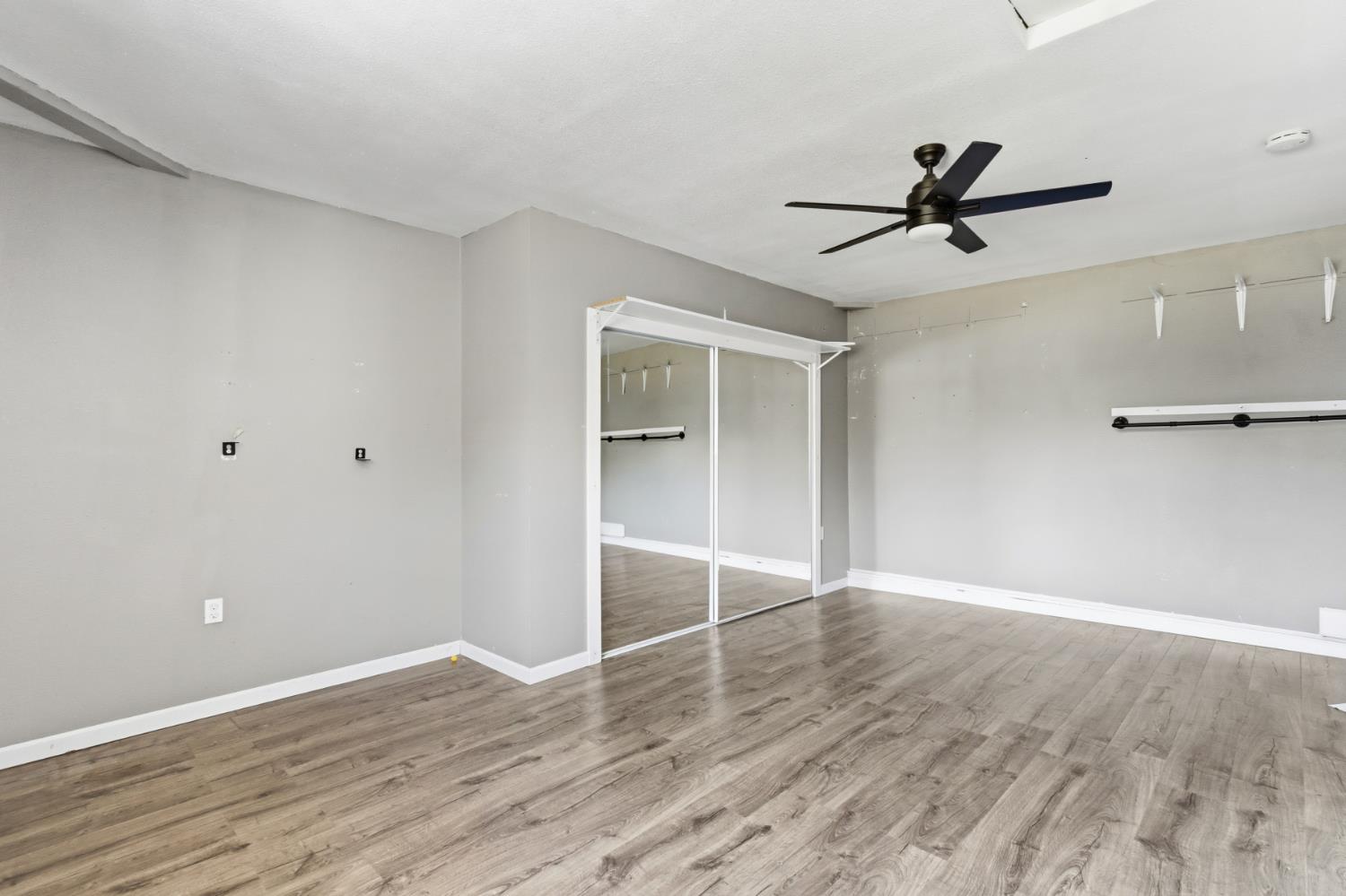 7208 7th Street Rio Linda, CA 95673 - Photo 14 of 41 a view of empty room with wooden floor and ceiling fan