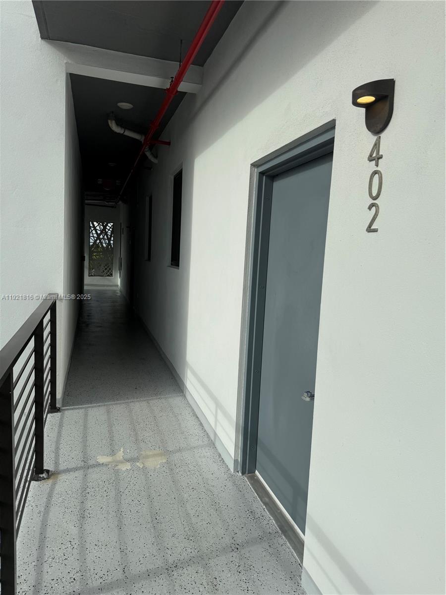 859 East 24th Street, Unit 402 Hialeah, FL 33013 - Photo 19 of 22 a view of a hallway