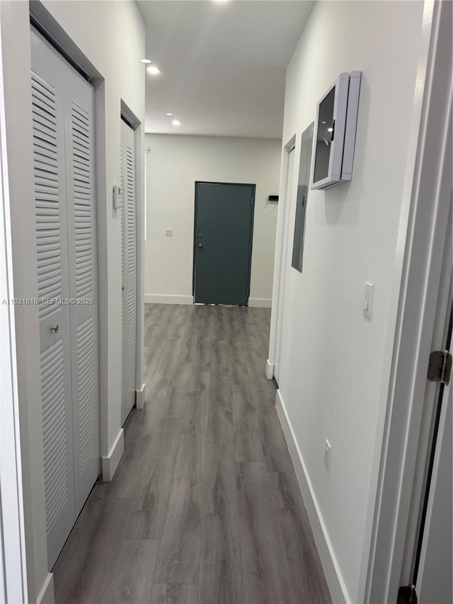 859 East 24th Street, Unit 402 Hialeah, FL 33013 - Photo 21 of 22 a view of hallway with wooden floor