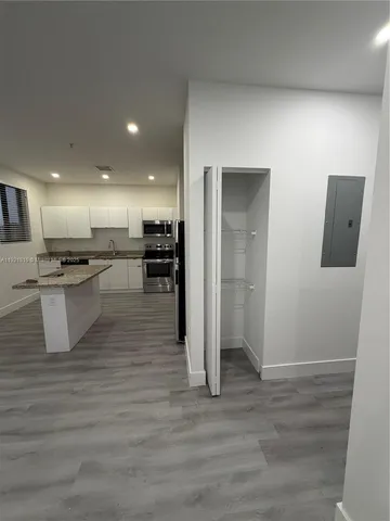 a view of kitchen with wooden floor