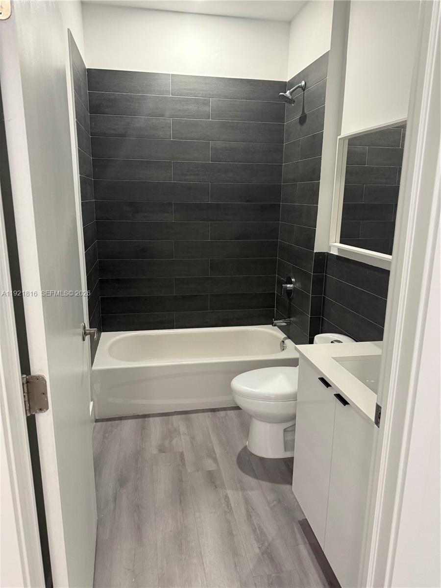 859 East 24th Street, Unit 402 Hialeah, FL 33013 - Photo 10 of 22 a bathroom with a toilet and a shower