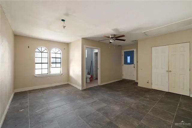 a view of an empty room with a window
