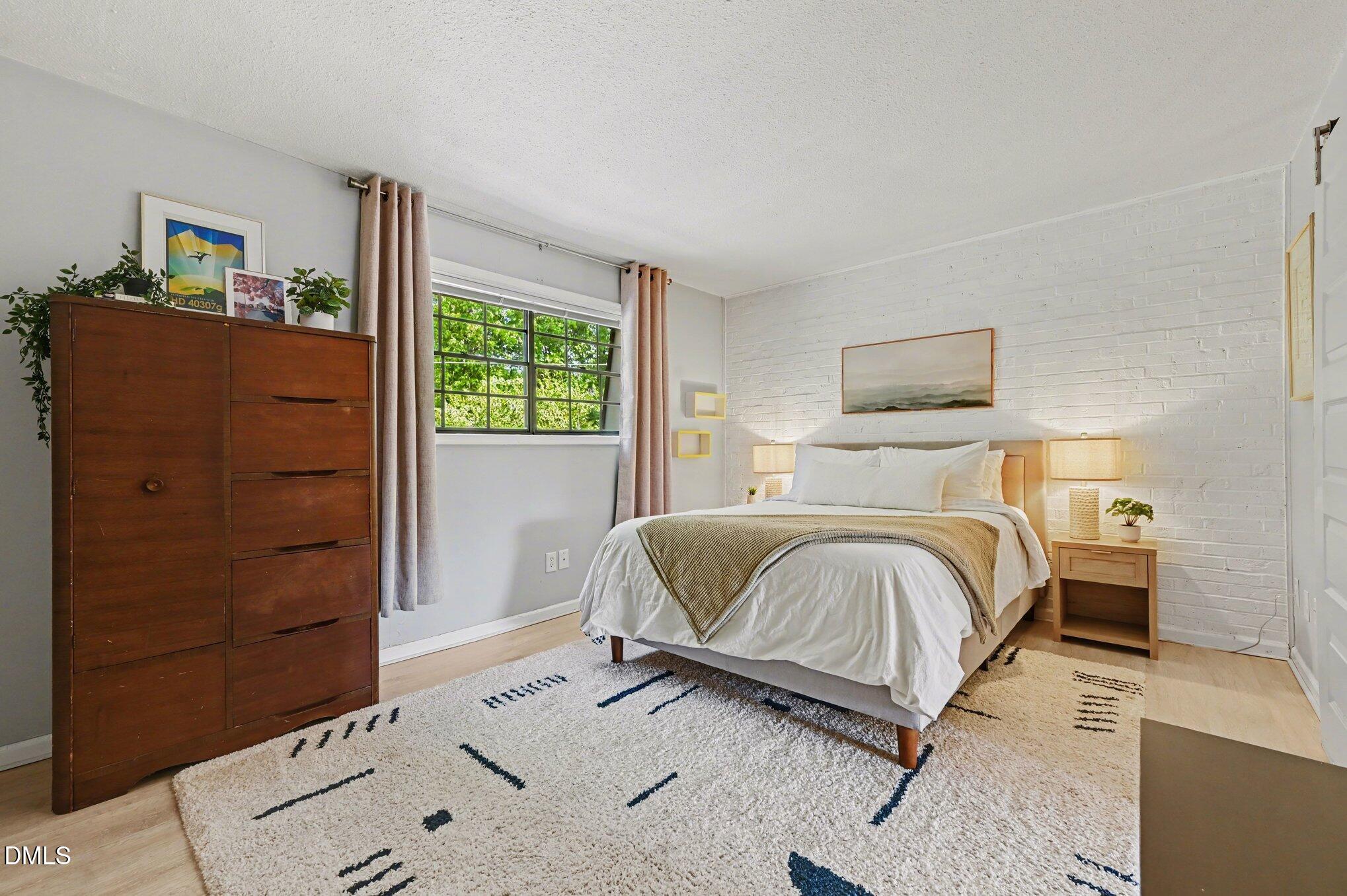 807 West Trinity Avenue, Unit 252 Durham, NC 27701 - Photo 9 of 23 a bedroom with a bed and window