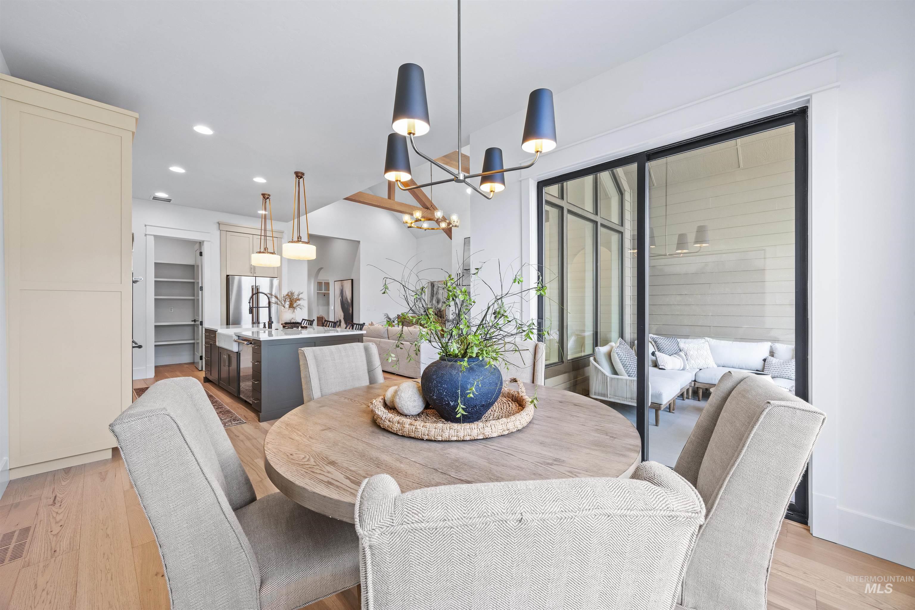 948 East Escalation Street Meridian, ID 83642 - Photo 15 of 44 Dining area with suspended lighting and light wood-style floors