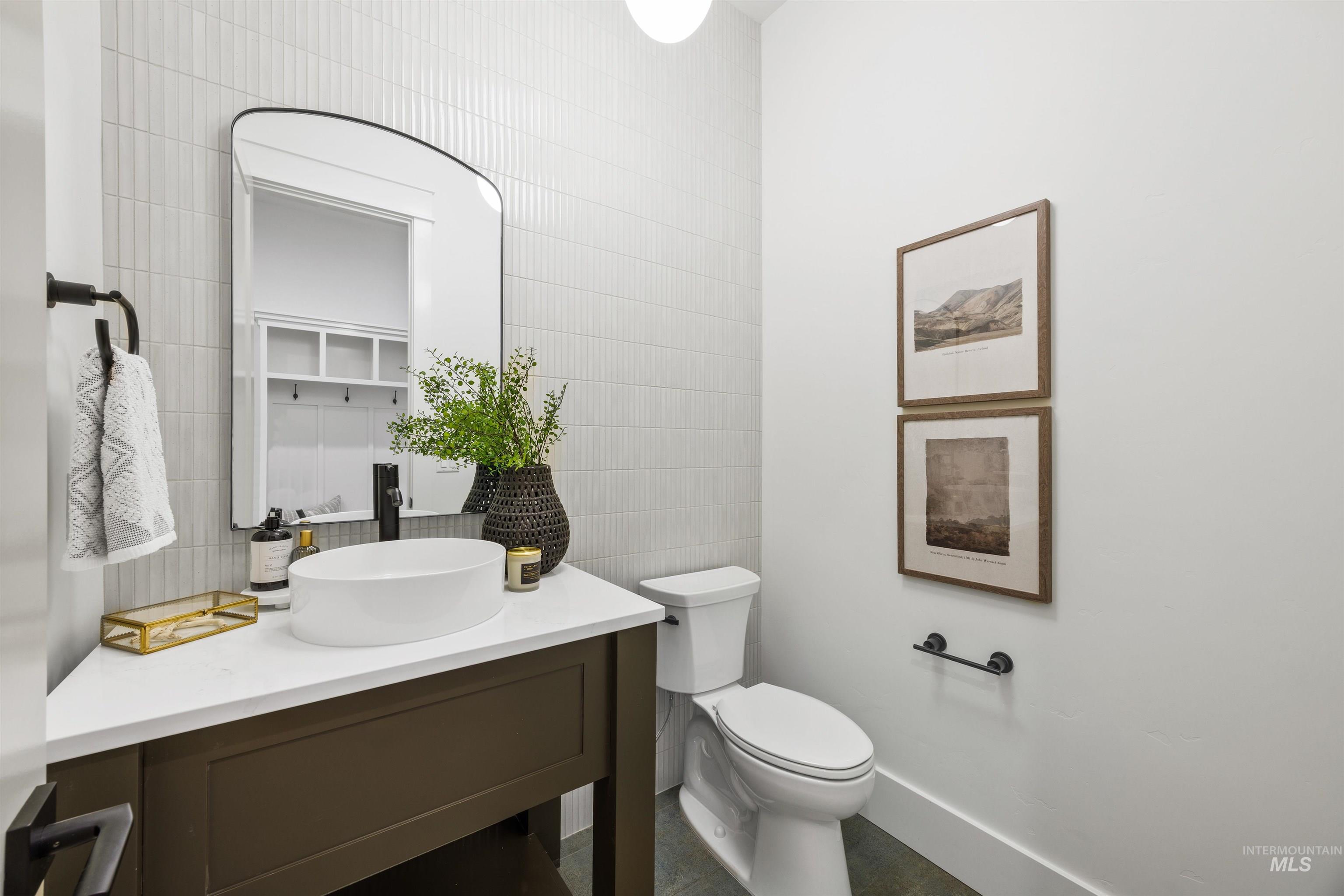 948 East Escalation Street Meridian, ID 83642 - Photo 34 of 44 Half bathroom with tile walls and vanity