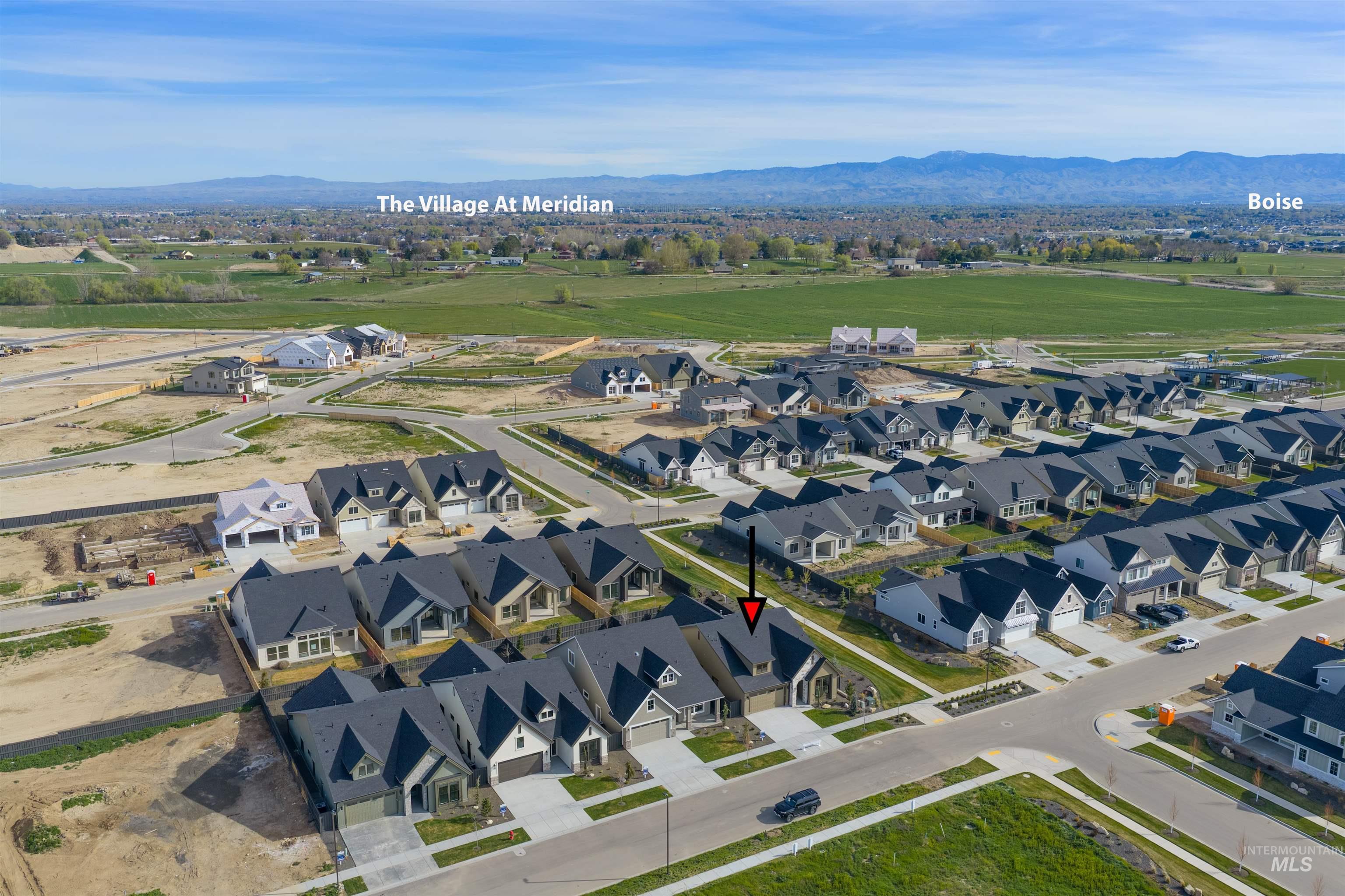 948 East Escalation Street Meridian, ID 83642 - Photo 41 of 44 Aerial overview of property's location with nearby suburban area and a mountainous background