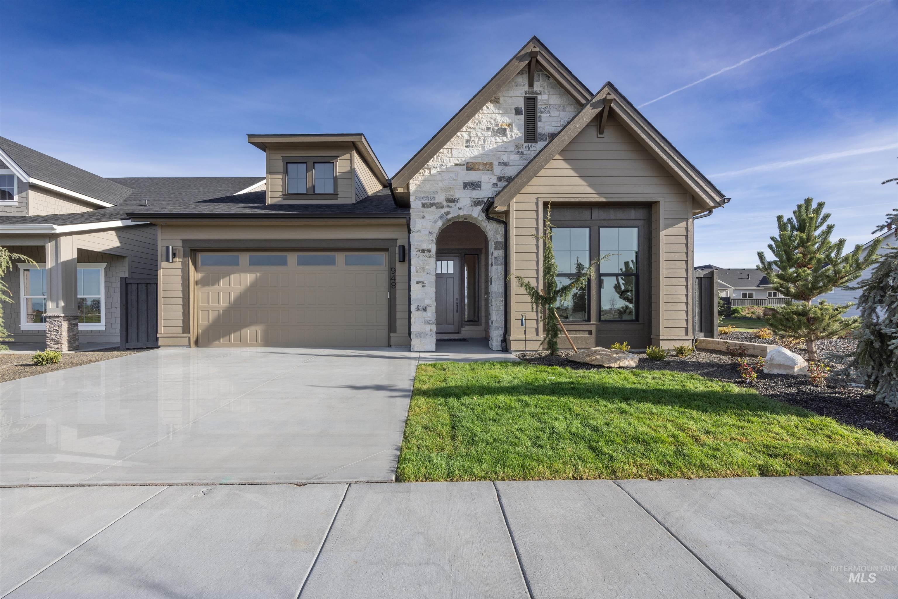 948 East Escalation Street Meridian, ID 83642 - Photo 43 of 44 View of front of property with driveway, a front lawn, and a garage