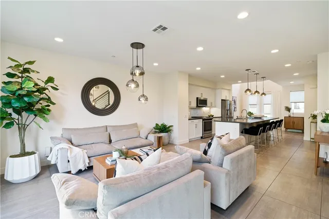 a bedroom with a bed and a potted plant