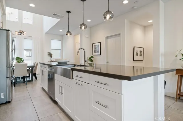 a living room with furniture flowerpot and window