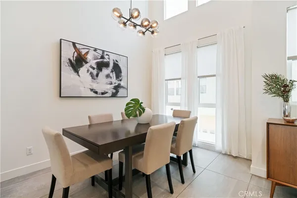 a kitchen with stainless steel appliances granite countertop a sink a stove a counter space and cabinets