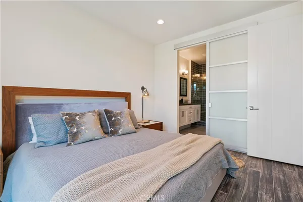 a dining room with furniture a chandelier and wooden floor