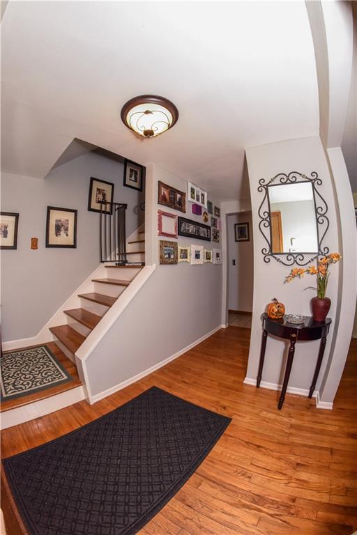1107 Rankin Road White Oak, PA 15131 - Photo 2 of 21 Beautiful entry with hardwood floors and stairs welcomes you into the home.