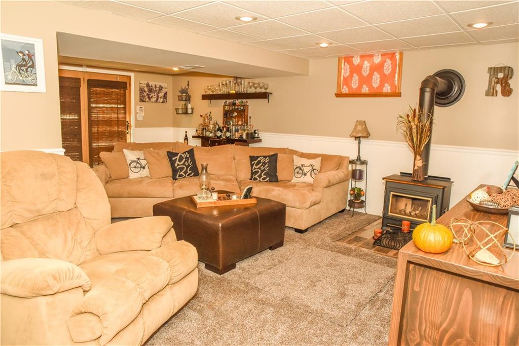 1107 Rankin Road White Oak, PA 15131 - Photo 14 of 21 The lower level is warm and inviting with a neutral pallet of colors, Waynes coating, brand NEW carpet and wood burning stove.
