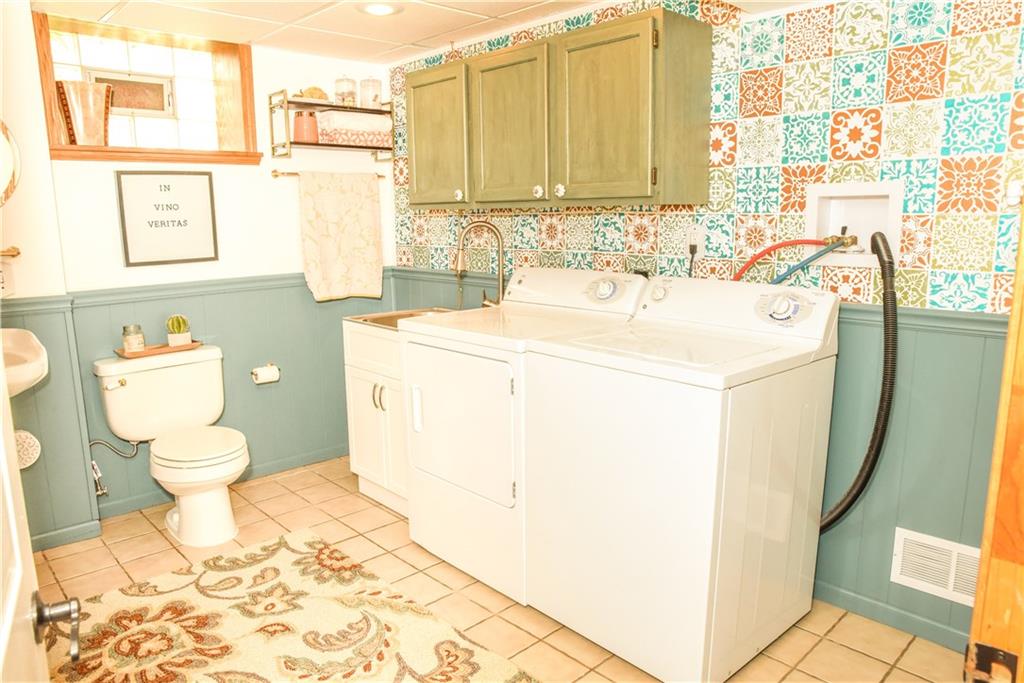1107 Rankin Road White Oak, PA 15131 - Photo 15 of 21 Beautiful hand stenciled wall completes the full bath/laundry area.