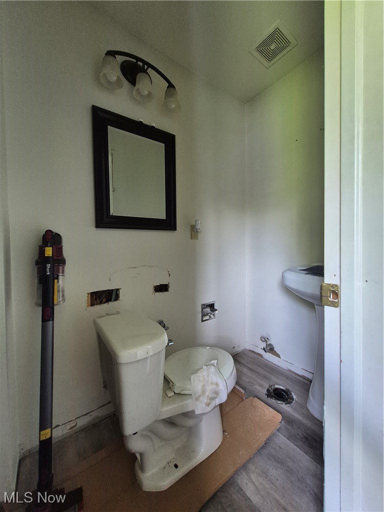 1534 Hubbard Road Madison, OH 44057 - Photo 11 of 15 Bathroom with new flooring. Toilet will be reinstalled.
