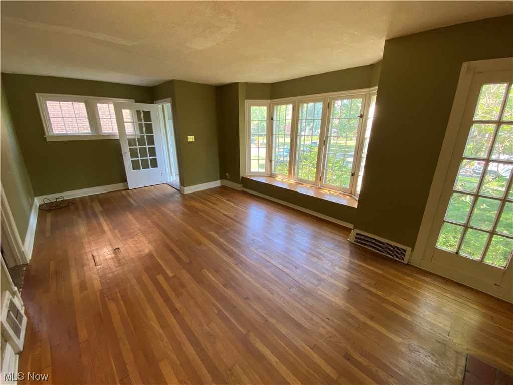 3630 Bainbridge Road Cleveland Heights, OH 44118 - Photo 4 of 21 Empty room with dark hardwood / wood-style floors