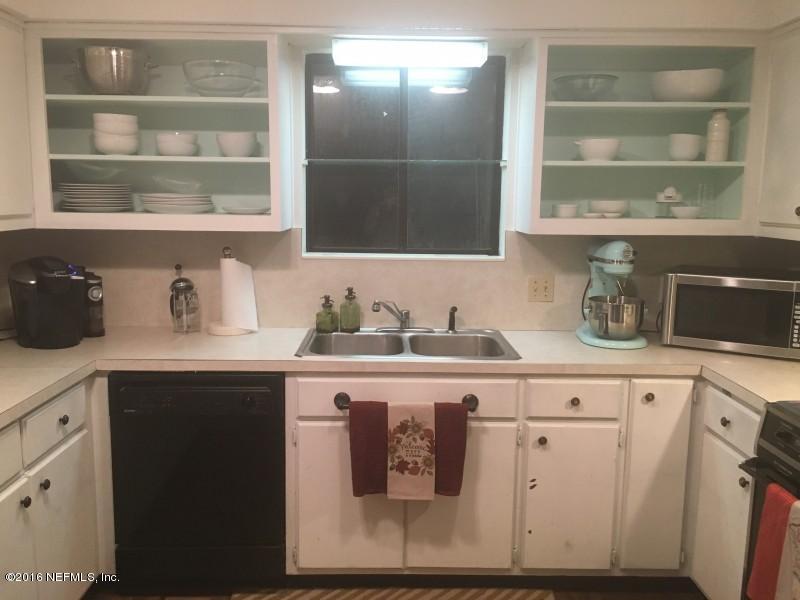 1209 Wedgewood Road St. Johns, FL 32259 - Photo 13 of 16 a kitchen with a sink and cabinets