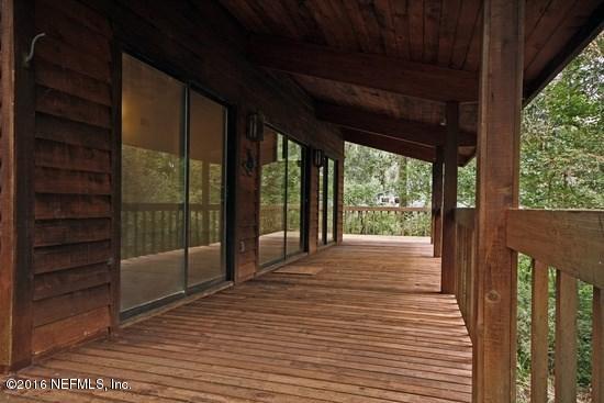 1209 Wedgewood Road St. Johns, FL 32259 - Photo 6 of 16 a view of porch with wooden floor and floor to ceiling window