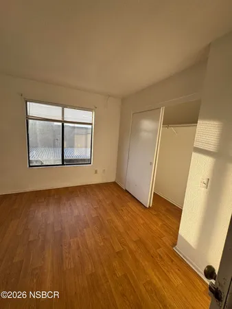 an empty room with wooden floor
