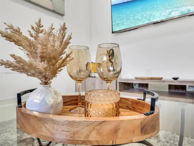 a view of a living room with a fireplace