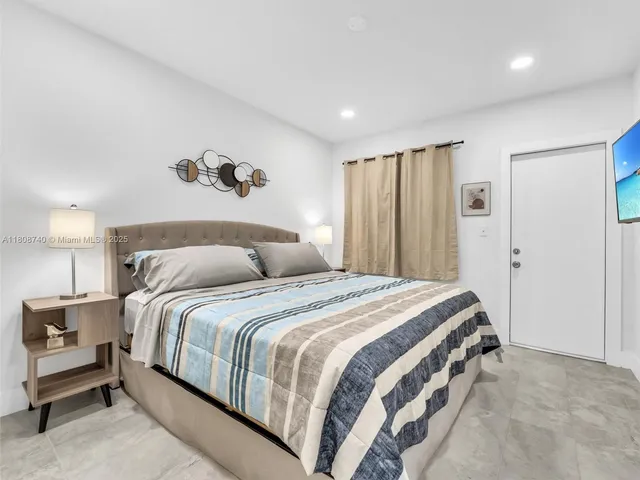 a bedroom with a bed and a cabinets