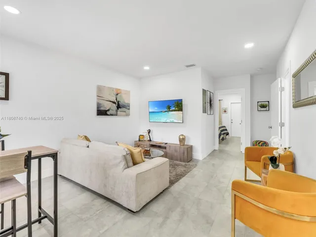 a living room with furniture and a couch