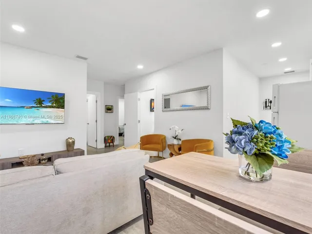 a bedroom with furniture and flowers