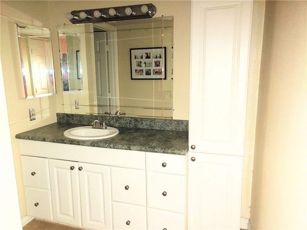 2811 South Fairview Street Santa Ana, CA 92704 - Photo 11 of 24 spacious vanity with matching tall storage to the right.