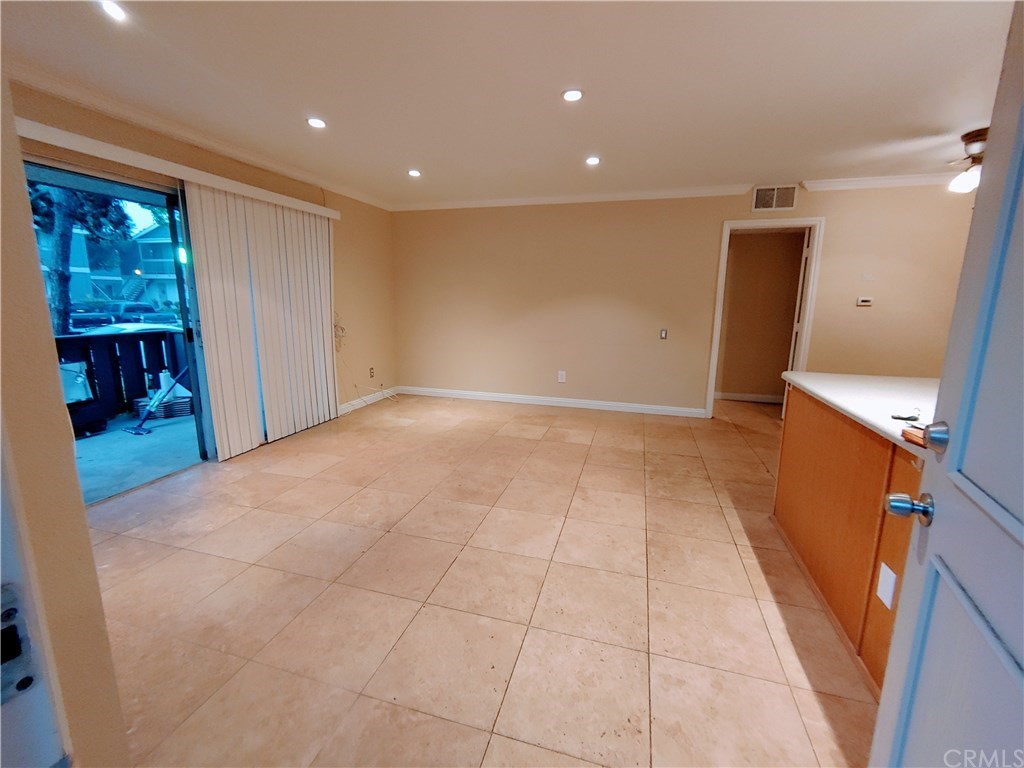 2811 South Fairview Street Santa Ana, CA 92704 - Photo 3 of 24 Entry View, from the left- sliding glass door to private patio, entry door to bedroom right, and bathroom left.