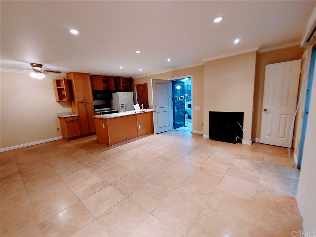 2811 South Fairview Street Santa Ana, CA 92704 - Photo 5 of 24 Wood cabinetry in kitchen. Refrigerator included.
