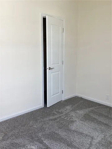 an empty room with closet area