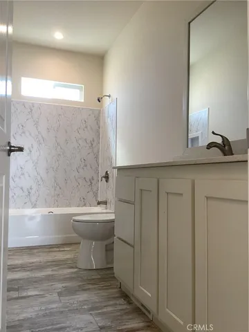 a bathroom with a sink a toilet and a bathtub