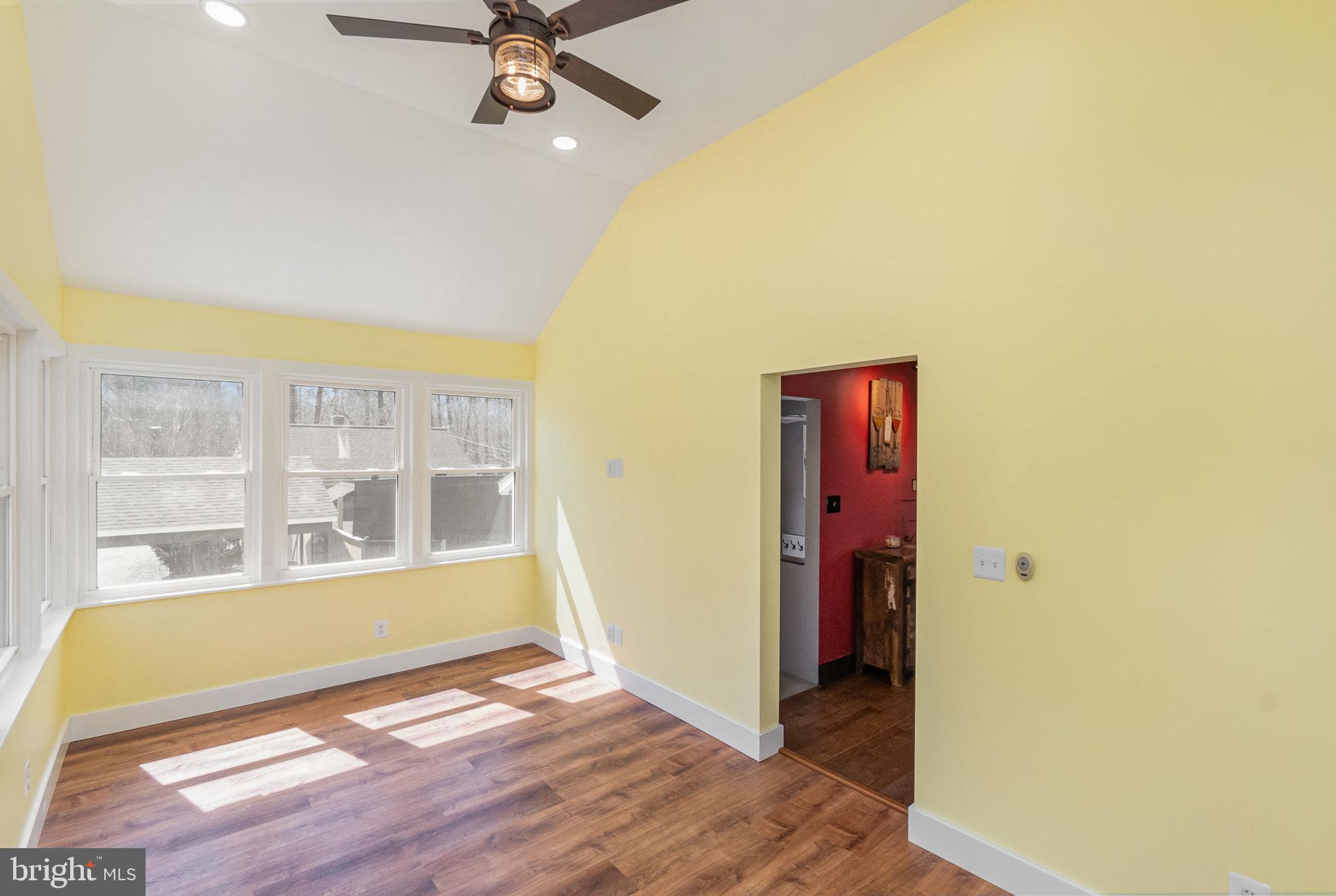 5813 Ebenezer Road White Marsh, MD 21162 - Photo 13 of 46 an empty room with wooden floor and windows