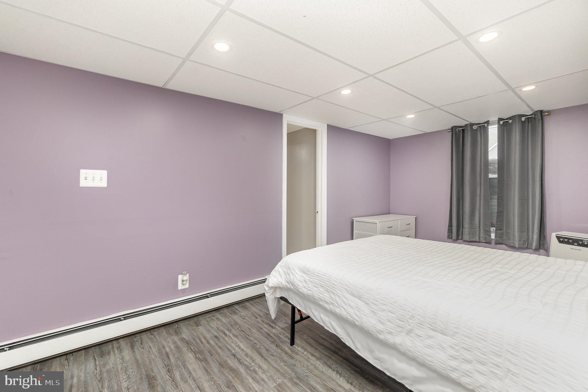 5813 Ebenezer Road White Marsh, MD 21162 - Photo 22 of 46 a bedroom with a bed and a table