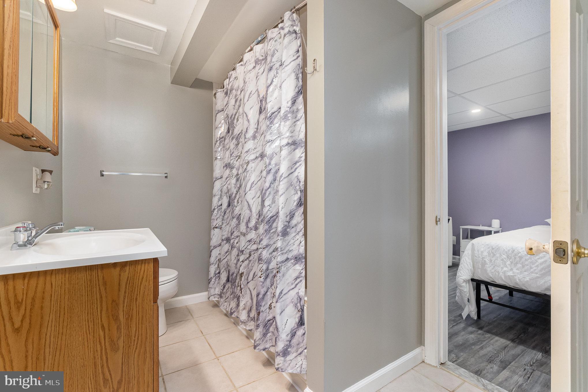 5813 Ebenezer Road White Marsh, MD 21162 - Photo 23 of 46 a bathroom with a sink and a mirror