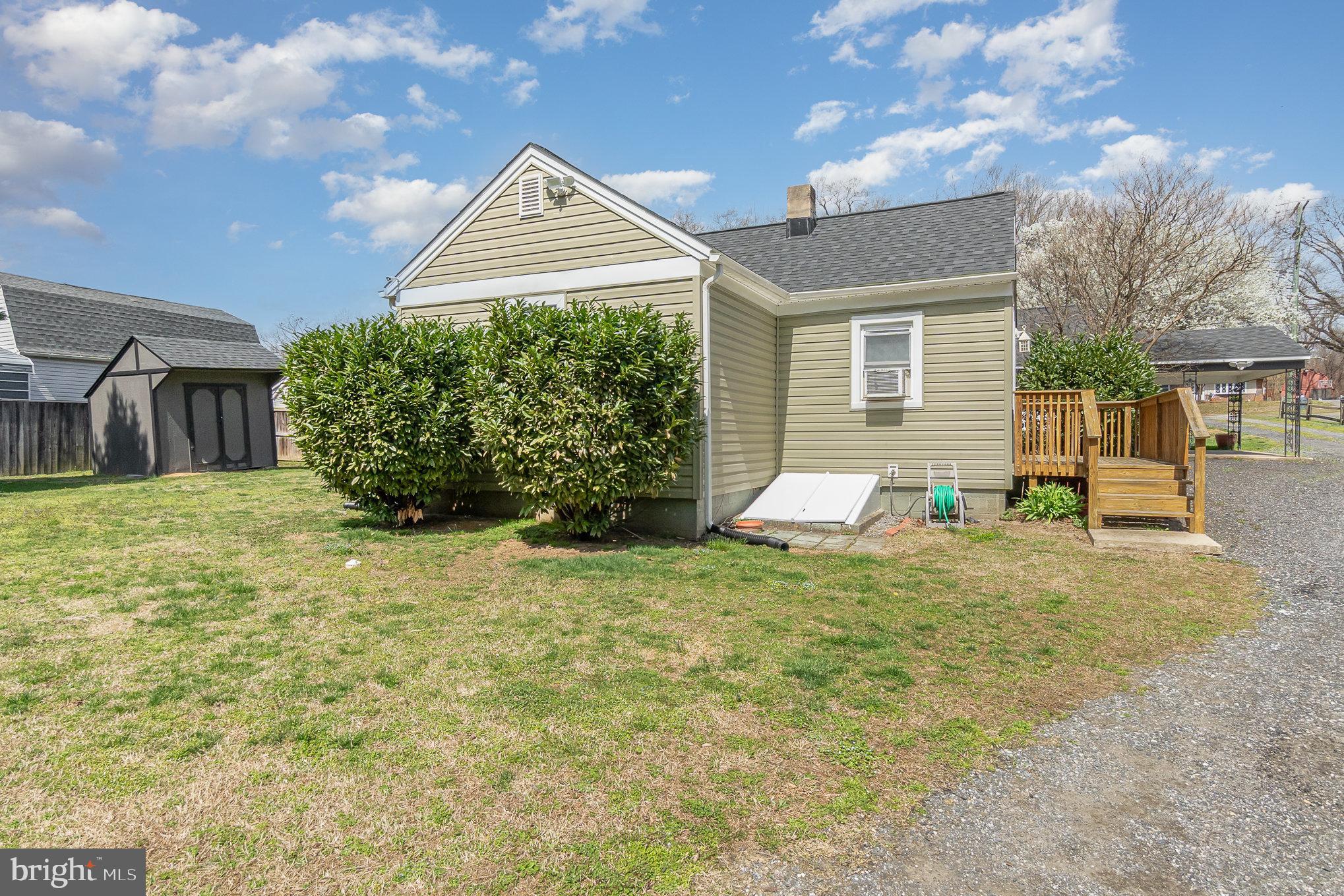 5813 Ebenezer Road White Marsh, MD 21162 - Photo 35 of 46 a view of a house with a yard and garage