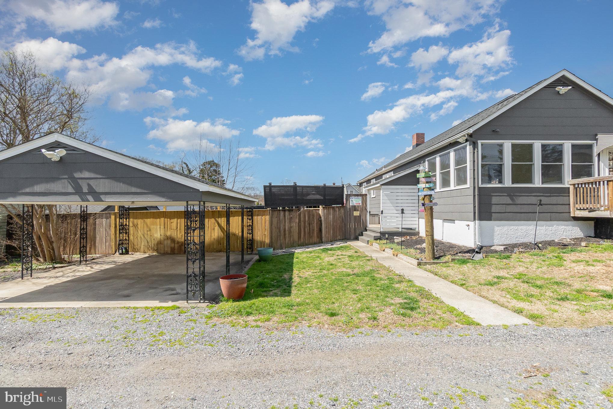 5813 Ebenezer Road White Marsh, MD 21162 - Photo 6 of 46 a front view of a house with a yard and garage