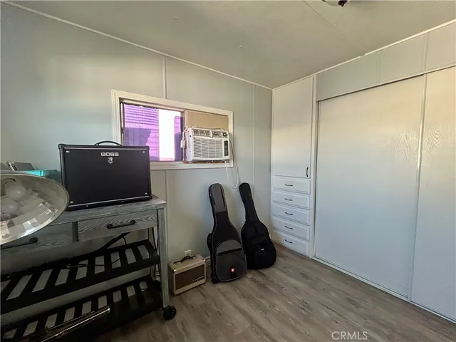 a room with furniture and flat screen tv