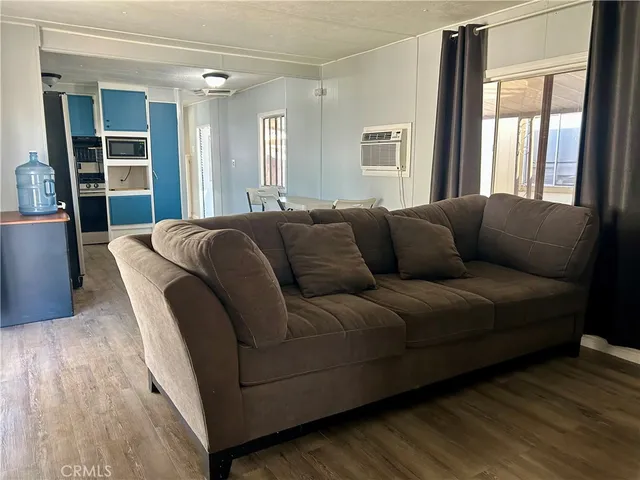 a living room with furniture and windows