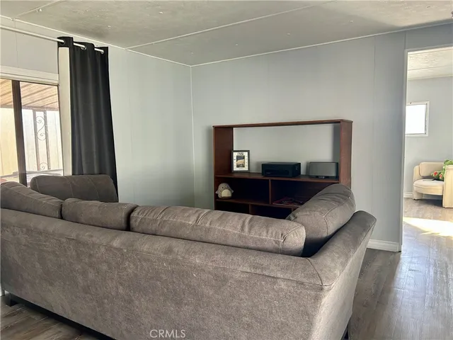 a living room with a couch and a large window