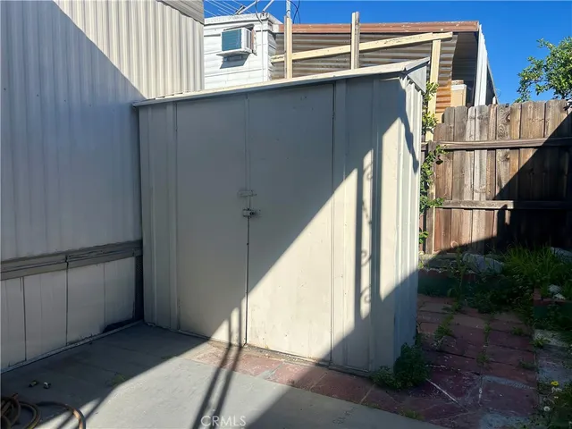 a view of entryway with wooden floor and stairs