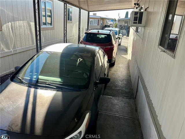 a bedroom with a bed and a mirror