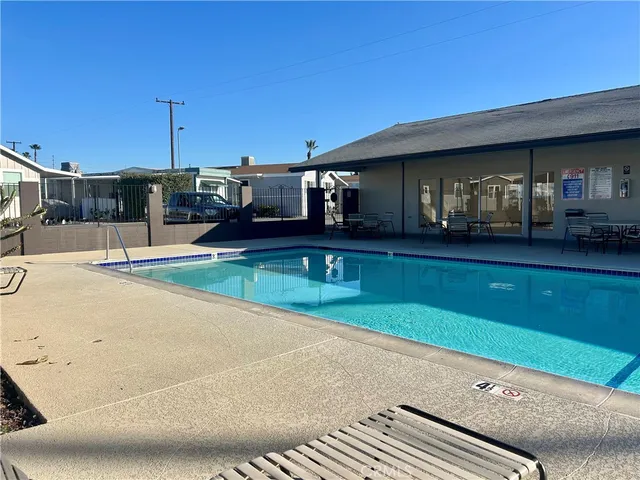 a view of a patio with table and chairs and potted plants