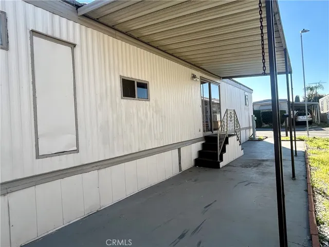 a view of a porch with seating space