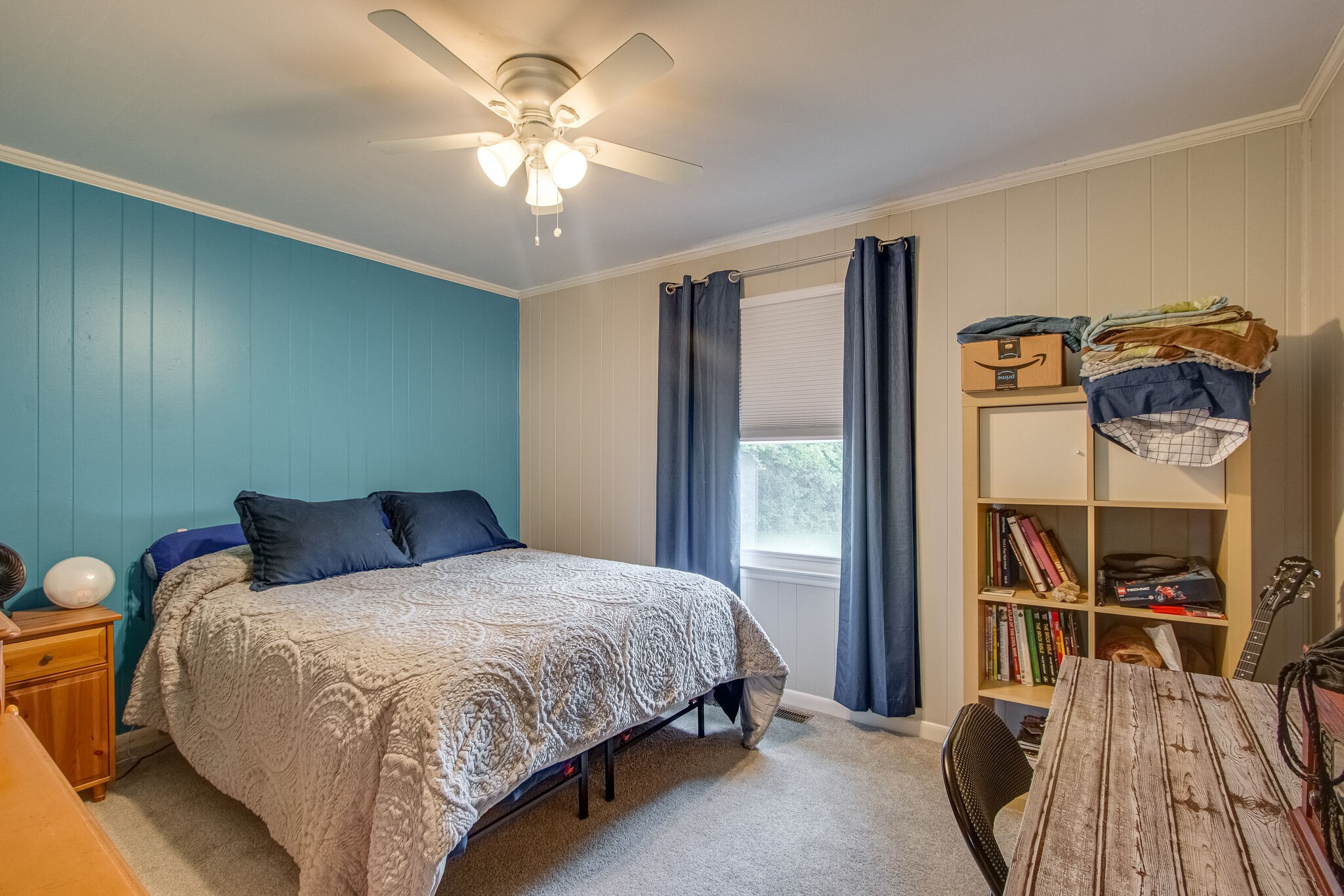 4543 South Carothers Road Franklin, TN 37064 - Photo 17 of 34 a bedroom with a bed and a chandelier