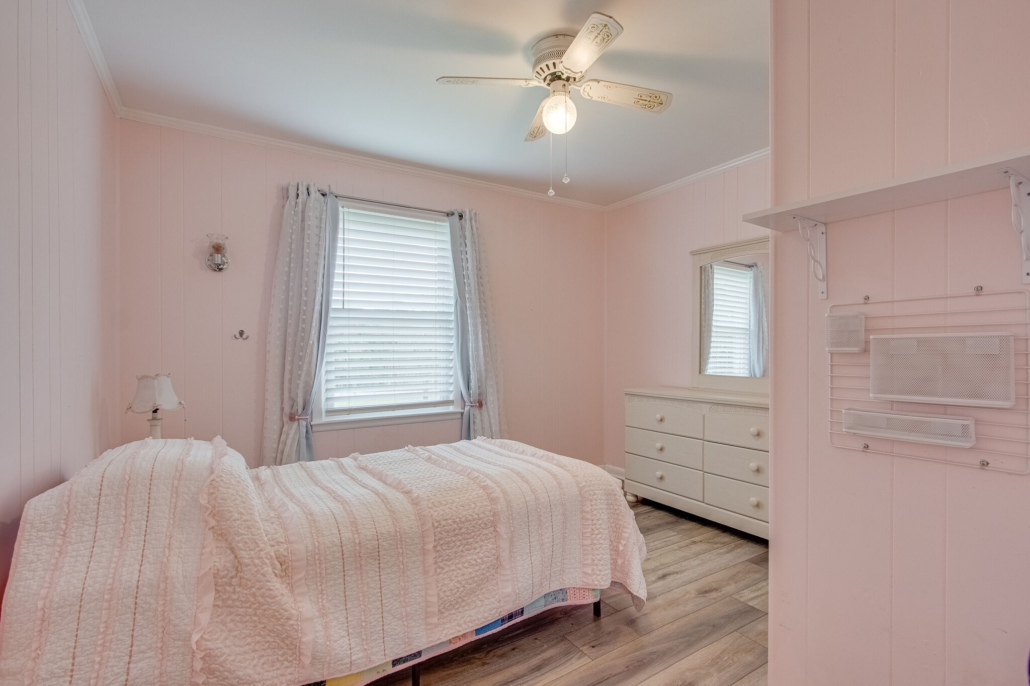 4543 South Carothers Road Franklin, TN 37064 - Photo 20 of 34 a bedroom with a large bed and a chandelier
