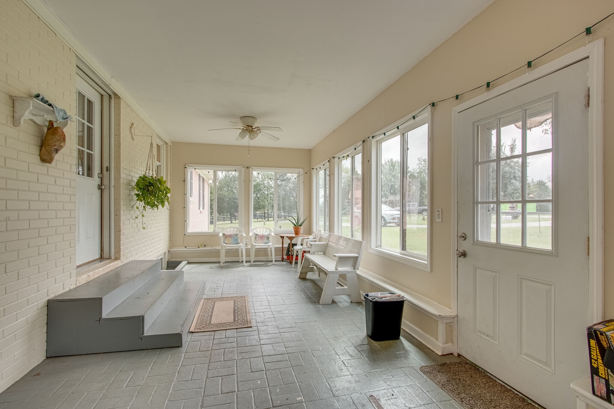 4543 South Carothers Road Franklin, TN 37064 - Photo 28 of 34 a living room with furniture and floor to ceiling windows