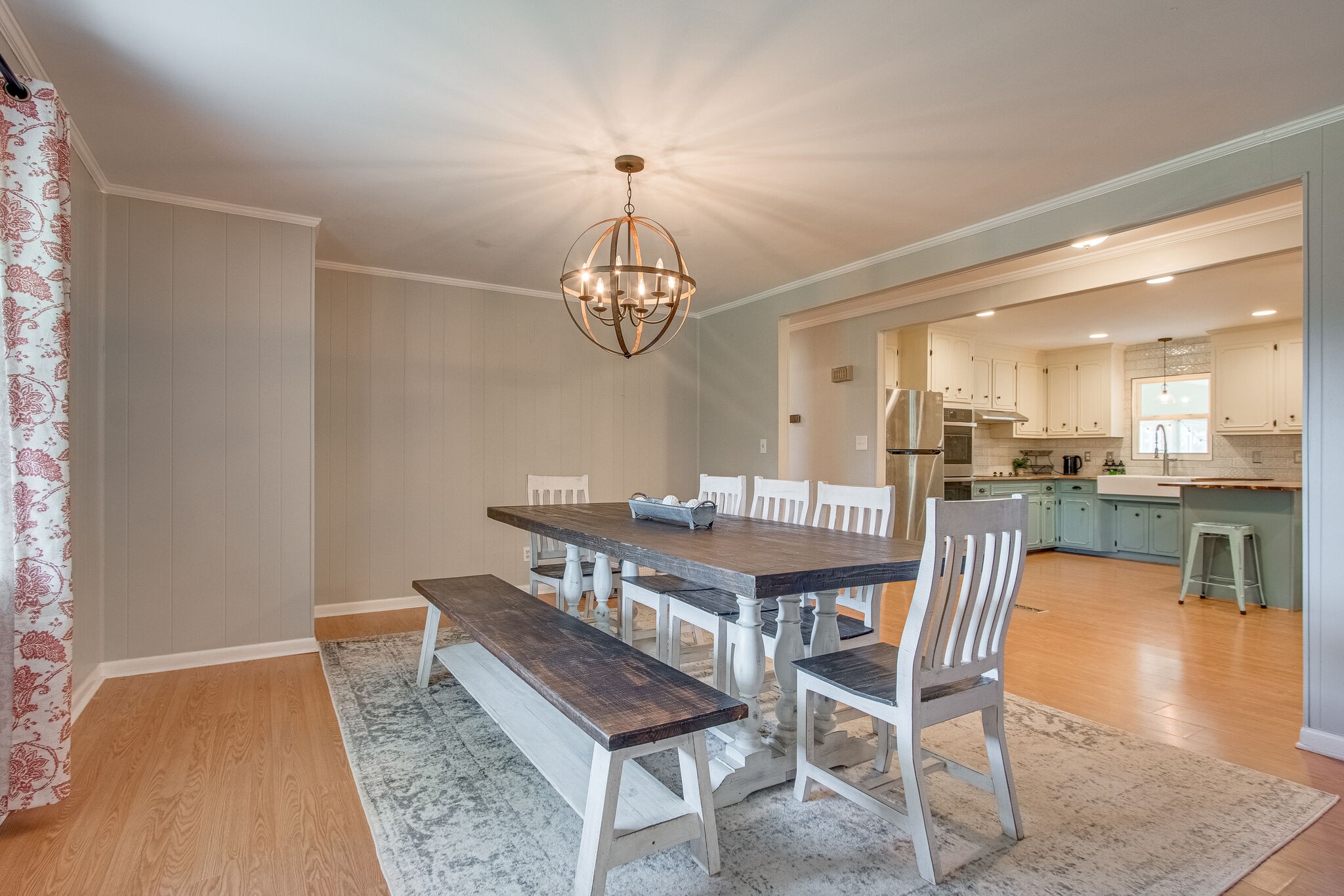4543 South Carothers Road Franklin, TN 37064 - Photo 5 of 34 a dining room with wooden floor a chandelier a wooden table and chairs