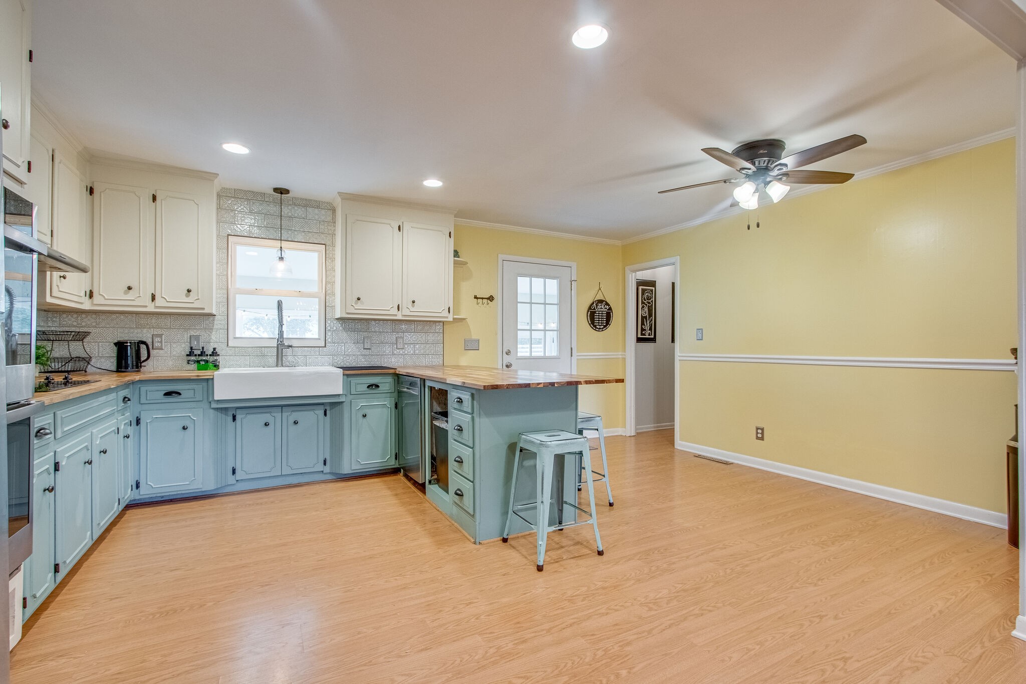 4543 South Carothers Road Franklin, TN 37064 - Photo 7 of 34 a kitchen with a sink cabinets and window