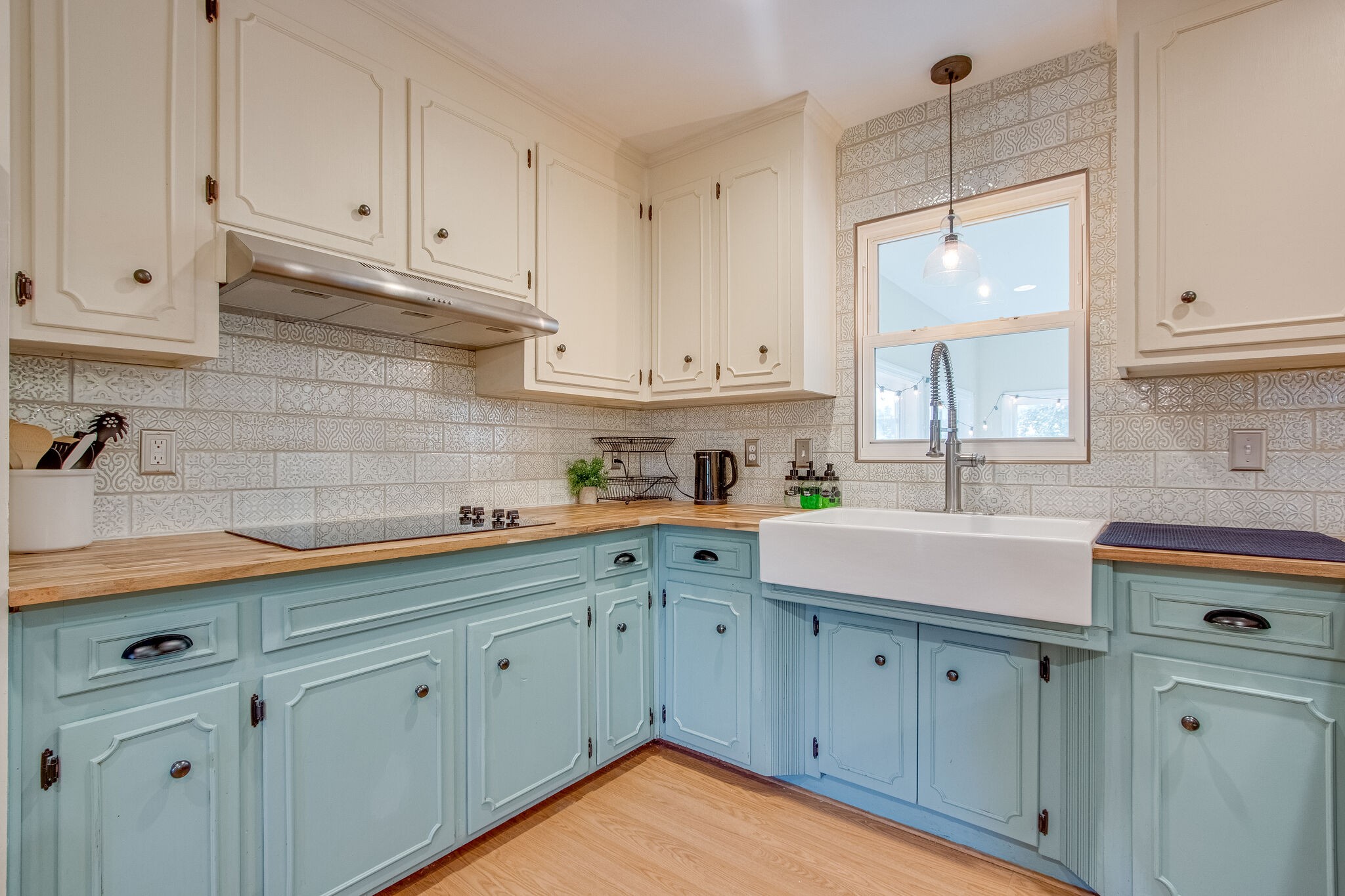 4543 South Carothers Road Franklin, TN 37064 - Photo 8 of 34 a kitchen with cabinets appliances a sink and a window